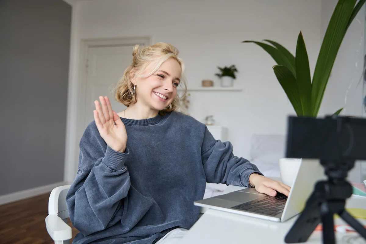 An online tutor teaching a Zoom session from a home setup